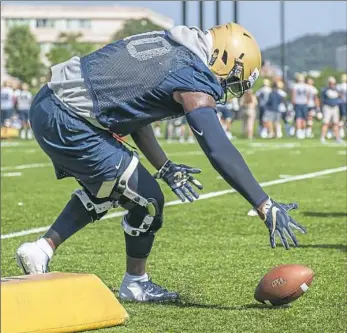  ?? Andrew Stein/Post-Gazette ?? Defensive tackle Keyshon Camp, a native of Lakeland, Fla., seemed at home in the heat Saturday, even wearing what appeared to be a short-sleeved hoodie underneath his jersey.