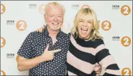  ??  ?? CHANGE IN HOT SEAT: Zoe Ball, who made her debut as the host of the BBC Radio 2 Breakfast Show today, with outgoing presenter Chris Evans.