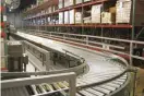  ??  ?? CONVEYORS MOVE PARTS THROUGH THE WAREHOUSE, SAVING TIME AND MAXIMIZING EFFICIENCY.