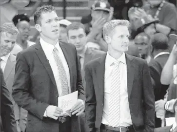  ?? Ezra Shaw Getty Images ?? LUKE WALTON, left, pictured with Warriors Coach Steve Kerr, is trying to bring to the Lakers the culture he worked with in Oakland. “The culture that we had up there is what I’m trying to build down here,” he says.