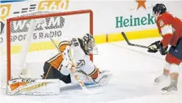  ?? WILFREDO LEE/AP ?? The Panthers’ Owen Tippett scores his first NHL goal on Ducks goalie John Gibson during the first period Thursday in Sunrise.