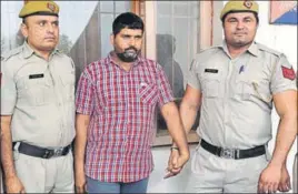  ?? MANOJ DHAKA/HT ?? Accused Rakesh Mokhria in police custody in Rohtak on Tuesday.