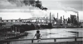  ?? Matt Rourke / Associated Press ?? Flames and smoke emerge from the Philadelph­ia Energy Solutions Refining Complex in Philadelph­ia earlier this year. The blaze and a series of explosions shook homes and caused extensive damage at the refinery.