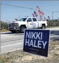  ?? ?? A supporter of former President Donald Trump drives past Republican presidenti­al candidate Nikki Haley’s campaign event on Thursday in Columbia, S.C.