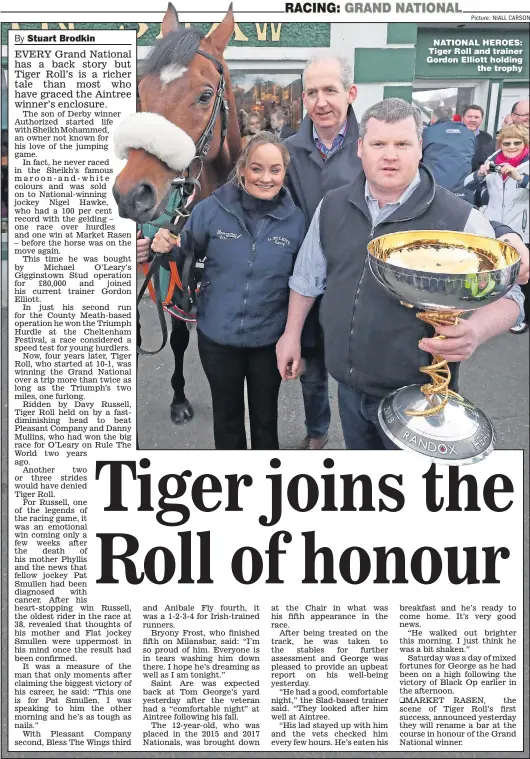  ?? Picture: NIALL CARSON ?? NATIONAL HEROES: Tiger Roll and trainer Gordon Elliott holding the trophy