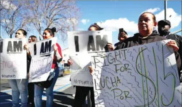  ?? JUSTIN SULLIVAN/GETTY IMAGES NORTH AMERICA/AFP ?? Fast food workers and union members protest to raise the minimum wage on February 12 in Oakland, California.