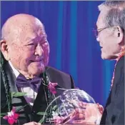  ?? Tracy Kumono Japanese American National Museum ?? COMMUNITY ACTIVIST Bruce Teruo Kaji, left, accepts the Japanese American National Museum’s Legacy Award in May.