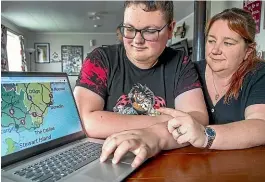  ?? WARWICK SMITH/ STUFF ?? Jacob Coker, 16, and his mother, Amanda, look over the route of the family’s six-week South Island adventure ticking items off his bucket list.