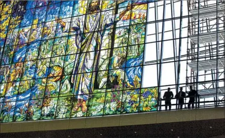  ?? Photograph­s from Judson Studios ?? JUDSON STUDIOS’ monumental windows for the Church of the Resurrecti­on in Leawood, Kan. Such work is documented in a new book.