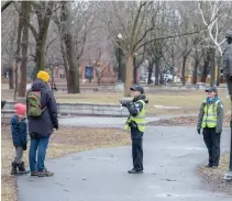  ?? RYAN REMIORZ THE CANADIAN PRESS FILE PHOTO ?? Police cadets keep an eye on social distancing at Lafontaine Park in Montreal amid surging cases of COVID-19 in Quebec.