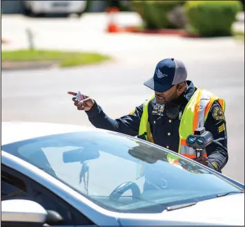  ?? EMIL LIPPE / THE NEW YORK TIMES ?? A police sergeant pulls a car over for speeding April 8 in Dallas. The police in Dallas have been compiling a running report on road rage episodes, with data on the time and place of each reported incident as well as whether it involved a gun.