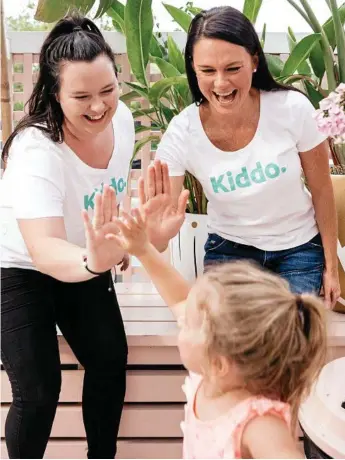  ?? Photo: Kiddo ?? NEW APP: Sharing a high-five are (from left) Kiddo babysitter Megan Spratt, app founder Rebecca Dredge and her three-year-old daughter Caitlin Dredge.