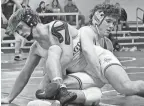  ?? FRANK DIRENNA/COLUMBUS DISPATCH ?? Olentangy Liberty’s Broc Fitzpatric­k, back, competes against Teays Valley’s Ethan Schwalbauc­h during their match at 175 pounds in a Division I district dual tournament Saturday. Fitzpatric­k won two matches by pin, helping the Patriots advance to the state.