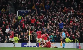  ?? Paul Ellis/AFP/Getty Images ?? Manchester United fans celebrate Cristiano Ronaldo’s winner against Atalanta. Photograph: