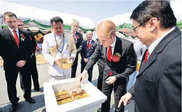  ??  ?? Andreas Schick (second right), Schaeffler’s chief executive for Asia-Pacific, helps to lay the foundation stone for the group’s new factory at Chon Buri’s Hemaraj Industrial Estate last Friday.