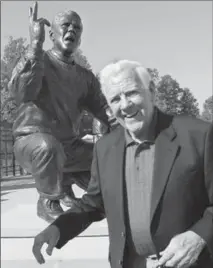  ?? ASSOCIATED PRESS FILE PHOTO ?? Ara Parseghian stands in front of a statue of himself at the University of Miami (Ohio) on Oct. 8, 2011. Parseghian died Wednesday at 94.