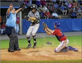  ?? AUSTIN HERTZOG — DIGITAL FIRST MEDIA ?? Left and center, Norchester’s Josh Fulmer slides into home plate to score the game-winning run on Nate Tomlin’s sacrifice fly in the ninth inning to win the Berks County League championsh­ip over Boyertown on July 11 at West Lawn.