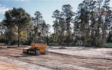  ?? Michael Minasi / Houston Chronicle ?? Constructi­on on the Lake Woodlands Crossing Retail Developmen­t is pictured Nov. 28, at the corner of Lake Woodlands Drive and Grogan Mills Road.