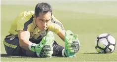  ??  ?? Claudio Bravo stretches before the match. — Reuters photo