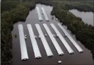  ?? STEVE HELBER — THE ASSOCIATED PRESS ?? Chicken farm buildings are inundated with floodwater from Hurricane Florence near Trenton, N.C., Sunday.