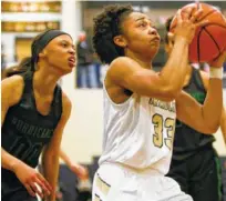  ?? STAFF PHOTO BY C.B. SCHMELTER ?? Bradley Central’s Jamaryn Blair drives against East Hamilton during Monday’s game at Soddy-Daisy High School.