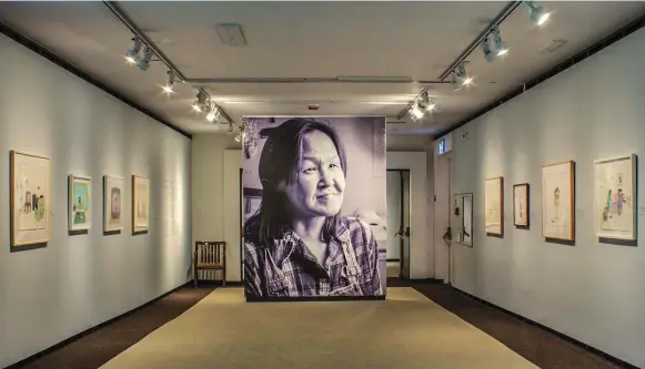  ?? PHOTOS COURTESY OF MCMICHAEL COLLECTION ?? A towering portrait of the late Annie Pootoogook greets viewers at the entry of Cutting Ice, an inadverten­t commemorat­ive exhibition of the revered Inuit artist’s work.