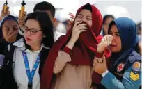  ?? -File photo ?? DISTRAUGHT: Families and colleagues of passengers and crew of Lion Air flight JT610 cry on the deck of Indonesia Navy ship KRI Banjarmasi­n as they visit the site of the crash to pay their tribute, at the north coast of Karawang, Indonesia.