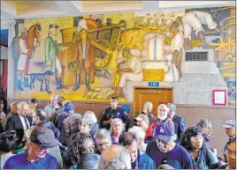  ?? Eric Risberg The Associated Press ?? People fill the main entryway of George Washington High School in San Francisco to view the “Life of Washington” mural during an open house Thursday.