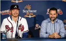  ?? ALYSSA POINTER / ALYSSA.POINTER@AJC.COM ?? Braves general manager Alex Anthopoulo­s (right) is gambling on third baseman Josh Donaldson, the 2015 AL MVP, rebounding from an injury-plagued 2018.