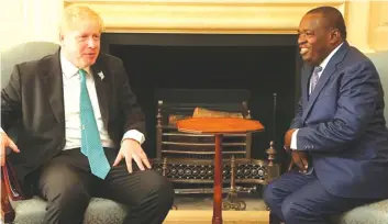  ??  ?? NOW . . . Lt-General (Retired) S.B. Moyo as Minister of Foreign Affairs and Internatio­nal Trade, meets his British counterpar­t Boris Johnson in London yesterday