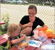  ?? GLENN GRIFFITH — MEDIANEWS GROUP FILE ?? Lunchtime at CAPTAIN’s free summer meal program in 2019 in Mechanicvi­lle’s Park Avenue Playground