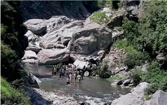  ?? — PTI ?? Security personnel carry out rescue work after a bus carrying Amarnath pilgrims fell into a gorge off the Jammu-Srinagar national highway in Ramban district on Sunday.