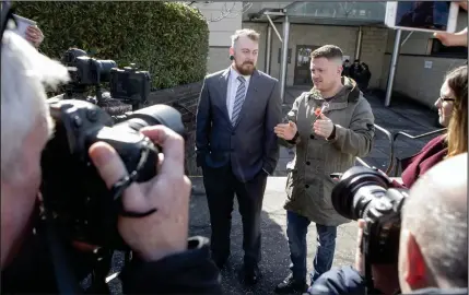  ??  ?? Mark Meechan, left, and former English Defence League leader Tommy Robinson speak to the media outside Airdrie Sheriff Court