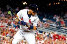  ?? Associated Press ?? n St. Louis Cardinals catcher Yadier Molina gets hit by a pitch Tuesday during the third inning against the Washington Nationals in Washington.