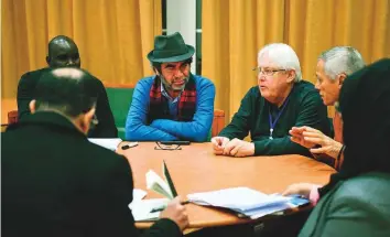  ?? AP ?? UN special envoy to Yemen Martin Griffiths (white hair) takes part in a work group with members of the Yemeni government and Al Houthi delegation­s during peace talks in Rimbo on Wednesday.