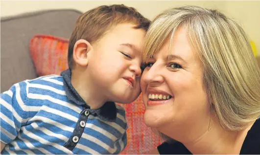  ??  ?? A Fife boy, who at 10 months old was Scotland’s youngest dialysis patient, is set for a life-transformi­ng kidney donation. Daniel Cornet, from Cairneyhil­l, here with mum Louise Paton, is now a suitable weight for the operation to go ahead.