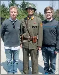  ??  ?? STANDING TO ATTENTION: With son Chester in North Korea