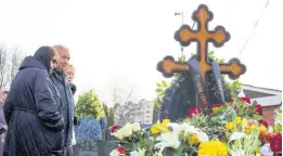  ?? AP * ?? From left: Lyudmila Navalnaya and Anatoly Navalny, parents of Russian opposition leader Alexei Navalny, and Navalny’s mother-in-law, Alla Abrosimova, visit the grave of the late Russian opposition leader on the 40th day after his death, an Orthodox tradition, at the Borisovsko­ye Cemetery in Moscow.