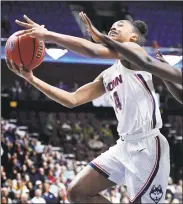  ?? Jessica Hill / Associated Press ?? UConn’s Aubrey Griffin goes to the basket in the first half against Temple on Saturday.