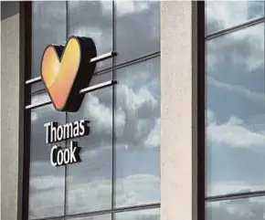  ?? AFP PIC ?? A closed-down branch of the global travel group Thomas Cook in Peterborou­gh, central England.