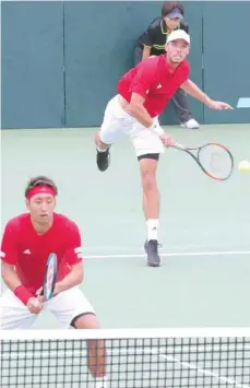  ?? — AFP ?? Japan’s Ben Mclachlan (top) and Yasutaka Uchiyama (bottom) serve against Bosnia and Herzegovin­a’s Tomislav Brkic and Nerman Fatic during their doubles match at the Davis Cup World Group play-off in Osaka on Saturday.