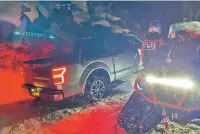  ?? WASHOE COUNTY SHERIFF’S OFFICE VIA THE NEW YORK TIMES ?? Volunteers help a driver who was stranded in Washoe County, Nev., on Monday after being led by a GPS system down a snow-covered, two-lane dirt road as an alternativ­e route to the closed Interstate 80. Public safety officials warned that routes offered by apps don’t always account for hazards to drivers.