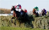  ?? Reuters ?? Derek Fox astride One For Arthur in action during the Grand National. —