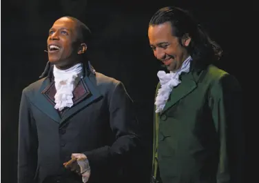  ?? Disney Plus ?? Rivals Aaron Burr (Leslie Odom Jr., left) and Alexander Hamilton (LinManuel Miranda) in “Hamilton.”