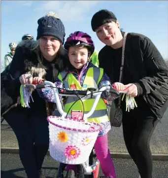  ?? Sarah Quirke getting a helping hand from Angela Quirke and Siobhan Behanat the Fenit Costal Cycle on Saturday. ??