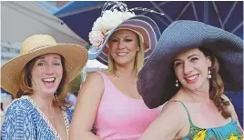  ?? STAFF PHOTOS BY STUART CAHILL ?? Laura Maglio, Linkie Marais and Diana James, above, and Melanie Wernick, Lonnie Brown and Geralyn Leone, right, don big hats to celebrate the 144th Kentucky Derby at a party at the InterConti­nental Hotel yesterday.
