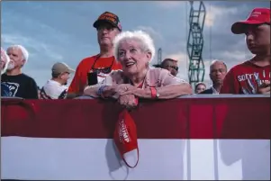  ?? The Associated Press ?? RALLY: Supporters of President Donald Trump listen as he speaks during a campaign rally at Cecil Airport, Thursday, in Jacksonvil­le, Fla.