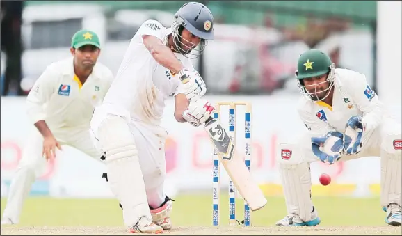  ??  ?? Sri Lankan batsman Dimuth Karunaratn­e bats against Pakistan during the fifth day of their second cricket Test match in Colombo. Sri Lanka on June 29, Sri Lanka won the match by 7 wickets. (AP)