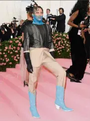  ??  ?? a beige suit with a sheer overlay, blue cowboy boots and sheer blue turtleneck. Cody Fern definitely delivered when it comes to the theme. you’ll have to admit, it can’t get more camp than what he wore.