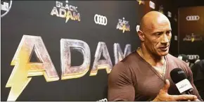  ?? Alex Lupul / Associated Press ?? Dwayne Johnson, star and producer of the film “Black Adam,” speaks at an event for the film in Toronto, Canada, on Oct. 13.